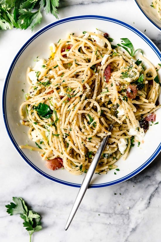 Spaghetti Carbonara is an Italian pasta dish made with bacon or pancetta, egg, black pepper and a blend of Pecorino Romano and Parmigiano-Reggiano.