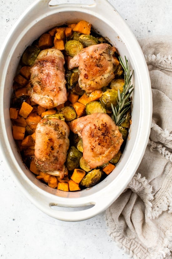 Baked Chicken Thighs with Brussels Sprouts and Sweet Potato, a quick and easy one-pot chicken dinner for a chilly, fall night.