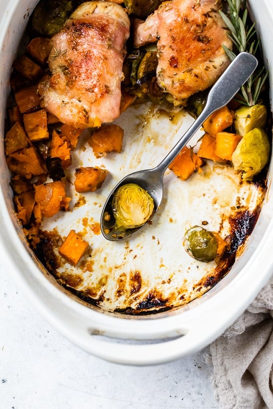 Baked Chicken Thighs with Brussels Sprouts and Sweet Potato, a quick and easy one-pot chicken dinner for a chilly, fall night.