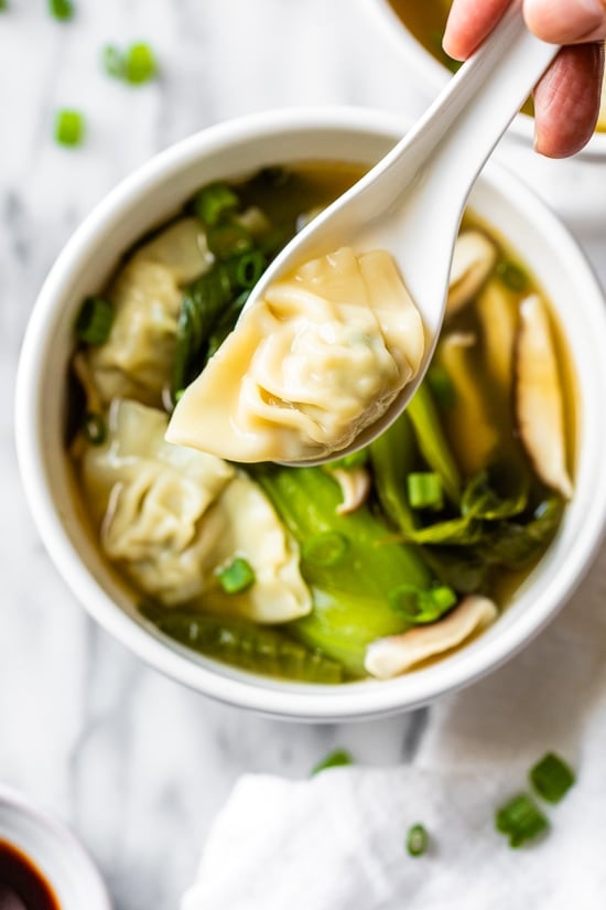 Loaded with vegetables, this quick and easy wonton soup is super simple, and takes under 15 minutes to make thanks to the frozen wontons.