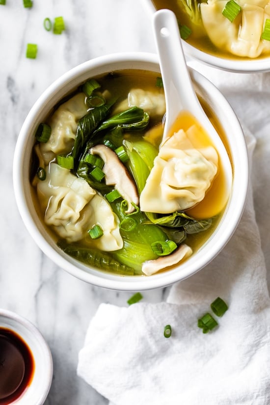 Loaded with vegetables, this quick and easy wonton soup is super simple, and takes under 15 minutes to make thanks to the frozen wontons.