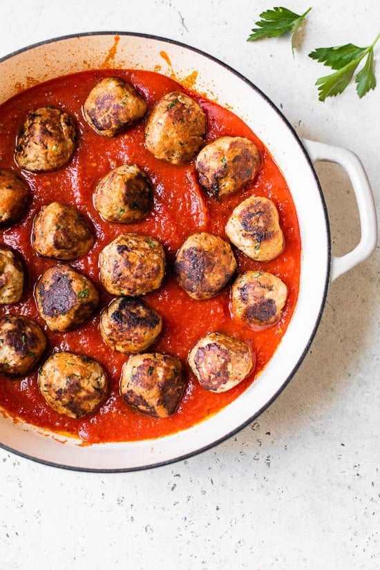 Cheesy Turkey Meatballs covered in sauce and cheese, made all in one skillet, serve this with a green salad and a little bread on the side for dipping!