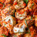 Cheesy Turkey Meatballs covered in sauce and cheese, made all in one skillet, serve this with a green salad and a little bread on the side for dipping!