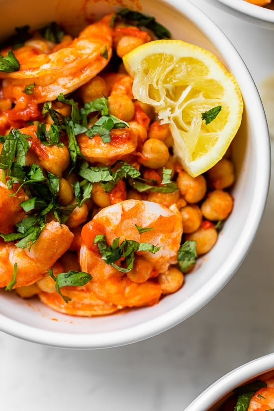This easy Harissa Shrimp and Chickpea dish is super fast, made all in one skillet, and takes under 10 minutes to make. A great way to use pantry and freezer staples.