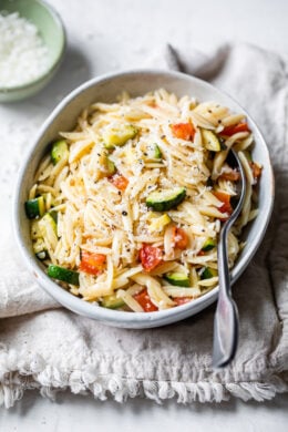 Orzo with Zucchini and Tomato is a quick and easy side dish that goes great with chicken, pork chops, or double the portion and enjoy it as a main dish.