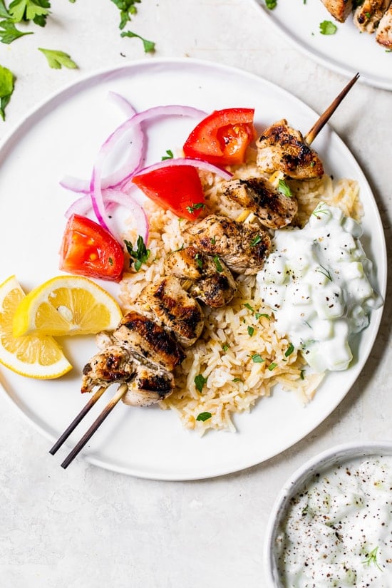 Grilled Chicken Kabobs on a plate with rice pilaf