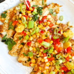 Zesty Lime Grilled Chicken with Pineapple Salsa on a platter.