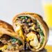 This Omelet Tortilla Breakfast Wrap takes a classic omelet and cooks it with a tortilla right in the skillet. Then simply roll it up and you have an easy on-the-go breakfast.