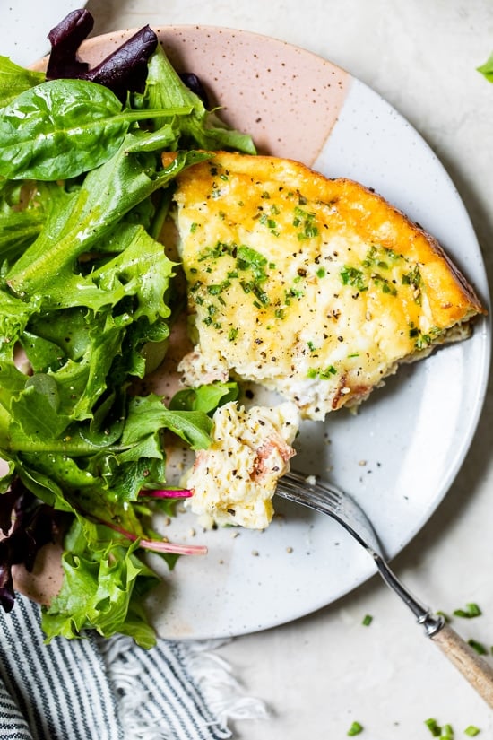 Crustless Quiche Lorraine on a plate with a fork.