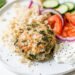 greek turkey burger on a plate with rice