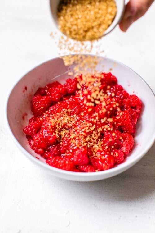 raspberries with sugar in a bowl.