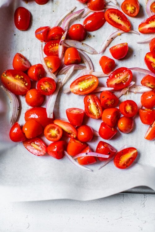 tomatoes on sheet pan with parchment