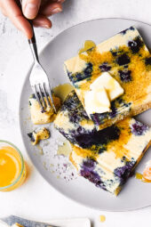 Lemon Blueberry Buttermilk Sheet Pan Pancakes on a plate with syrup.