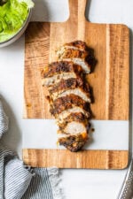 sliced chicken breast on cutting board