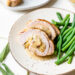 Stuffed Turkey Breast with Cranberry Stuffing with green beans.
