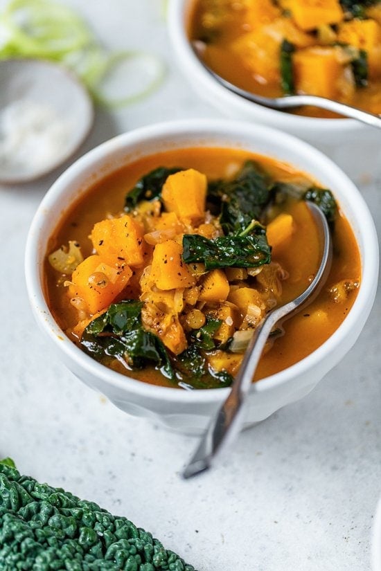 Lentil Soup with Butternut and Kale with a spoon