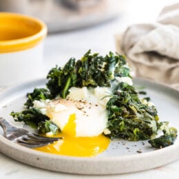 egg with runny yolk and spinach.