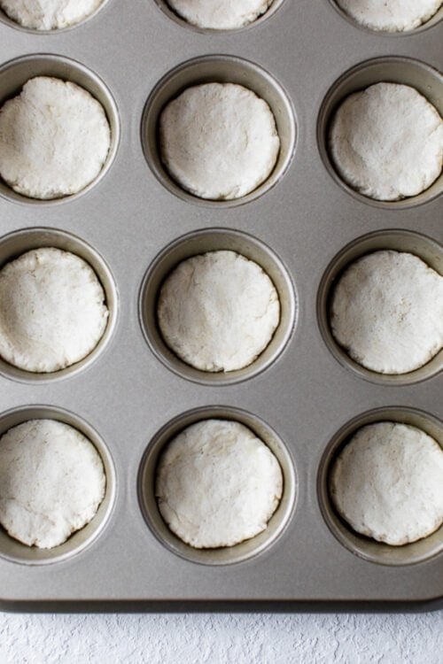 muffin tin with dough