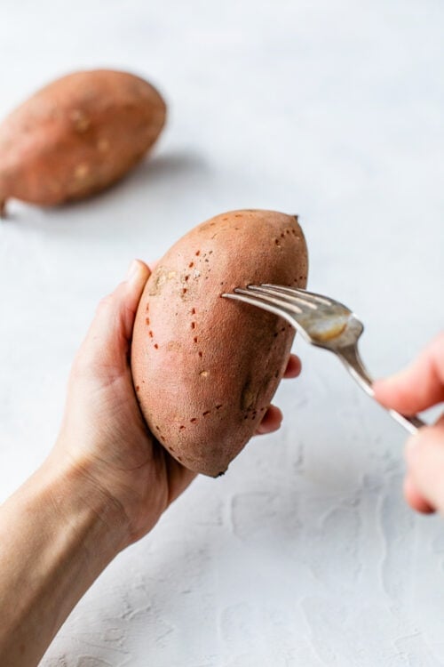 poke holes all over sweet potato with a fork