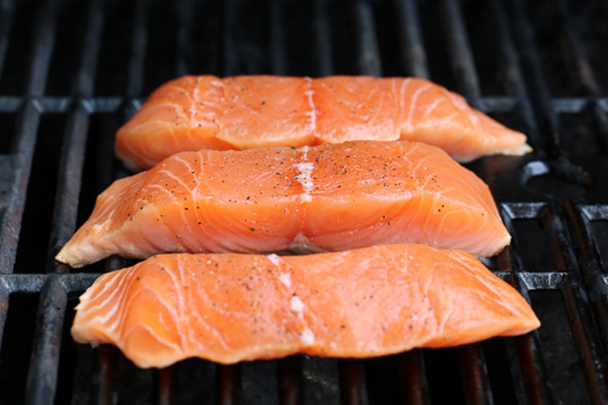 grilling salmon on an outdoor grill