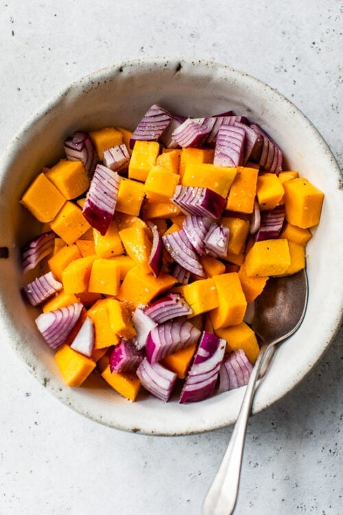 bowl with butternut squash cubed and red onions
