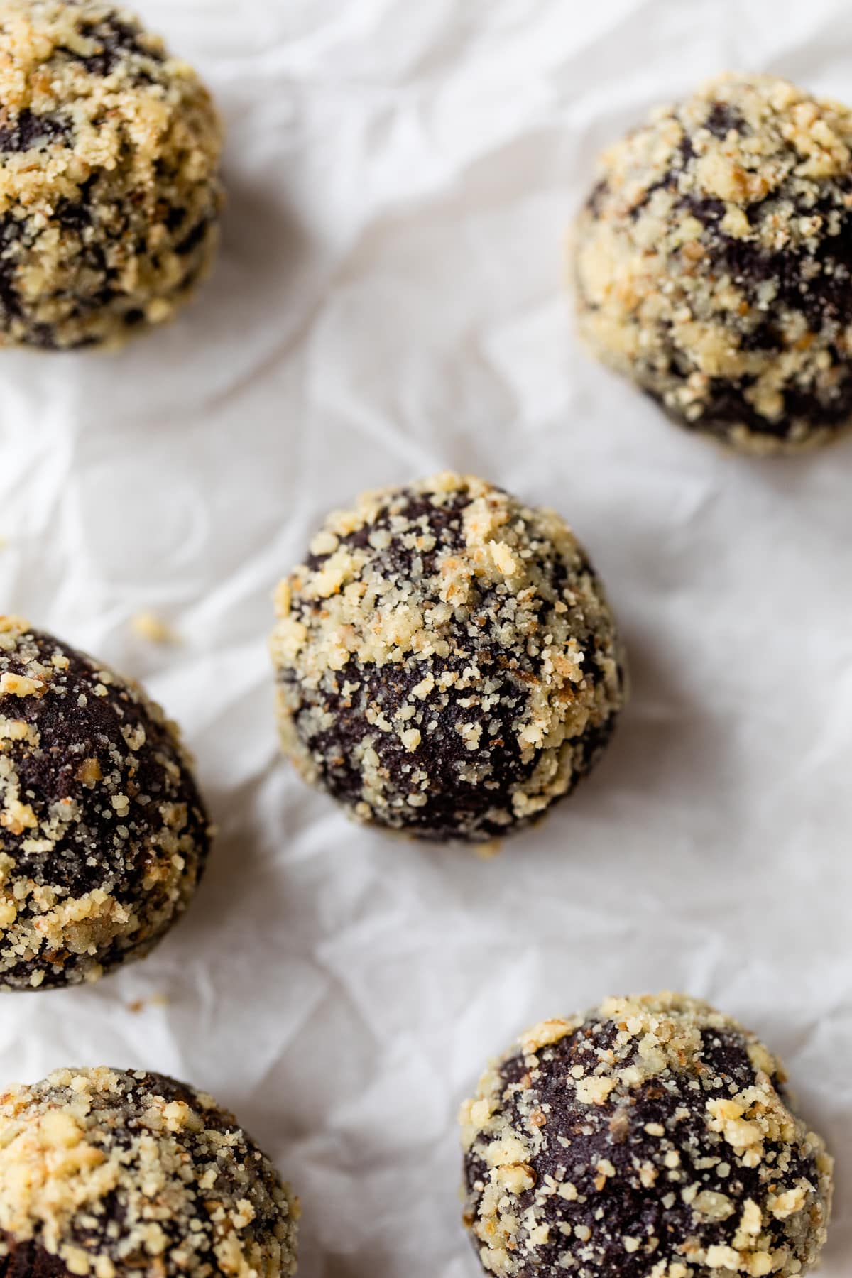 Overhead view of date energy balls on parchment paper