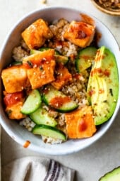 Broiled salmon bowl with avocado and cucumber