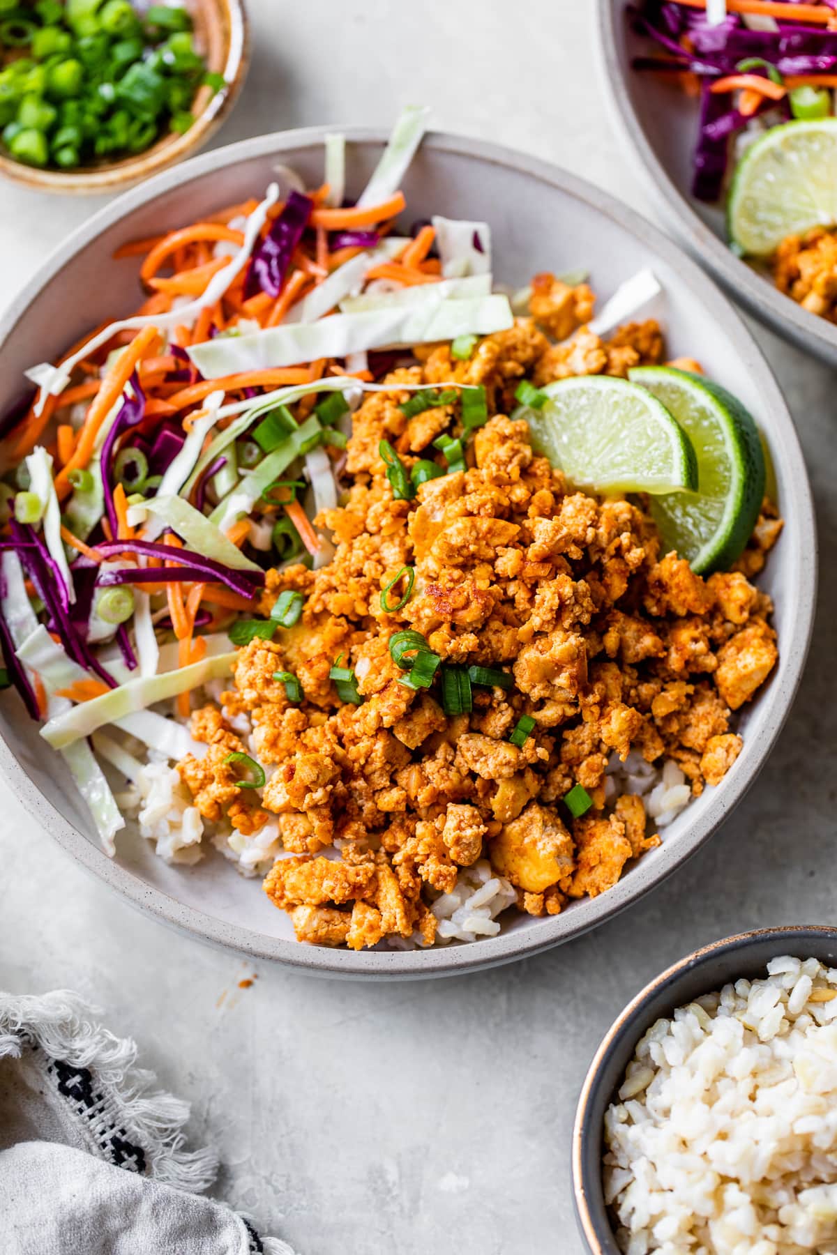 Tofu rice bowl with vegetables and lime