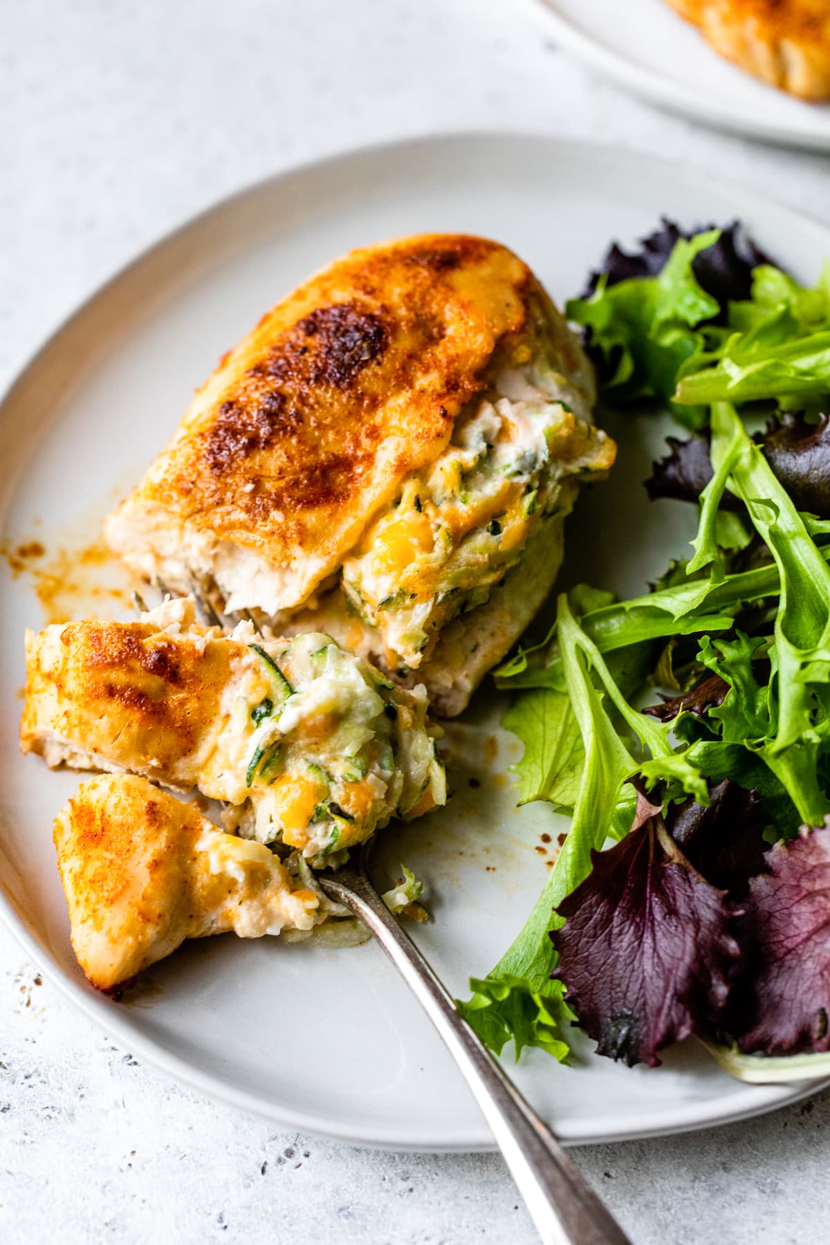 Stuffed chicken breast and salad