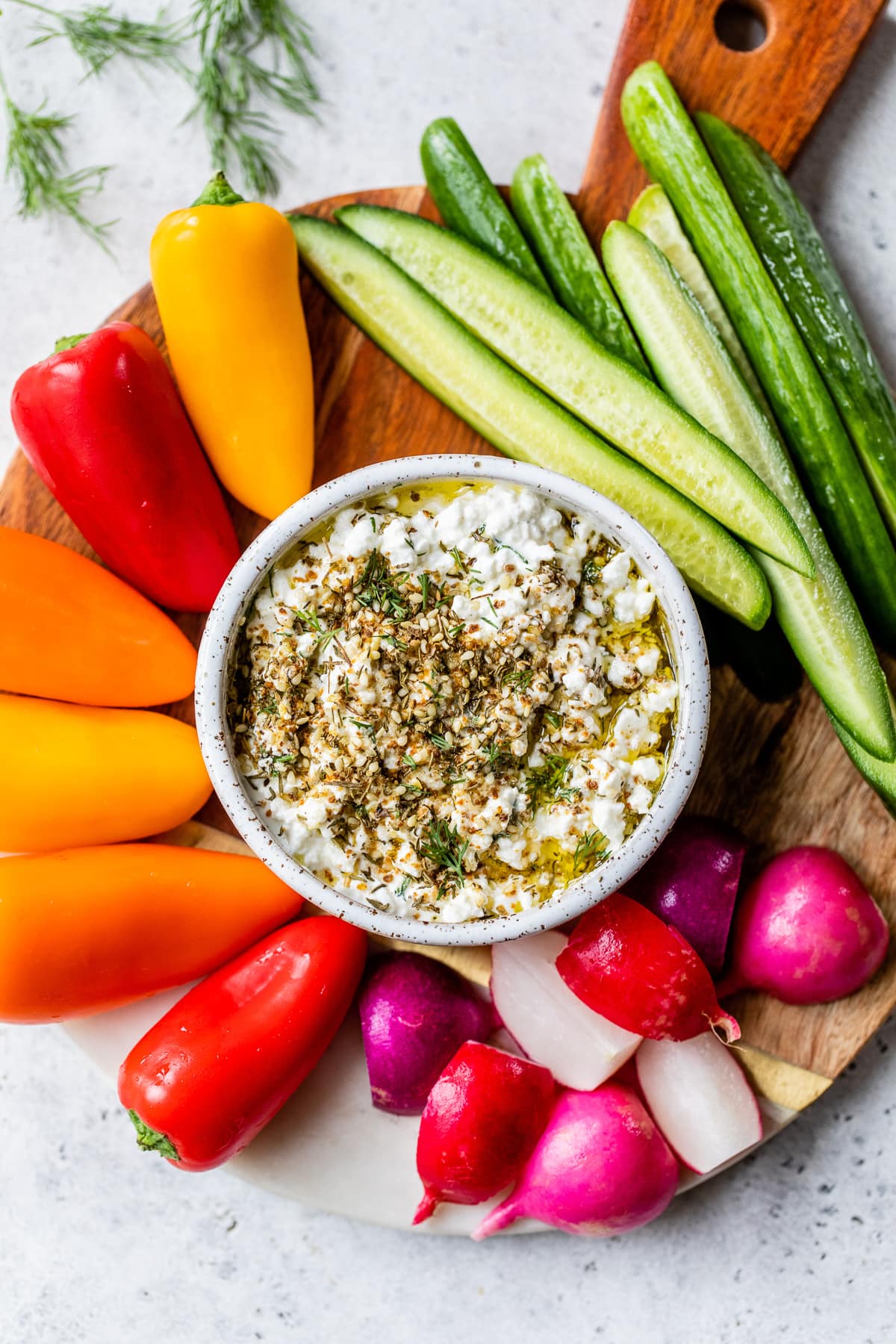 platter with cut up veggies and cottage cheese