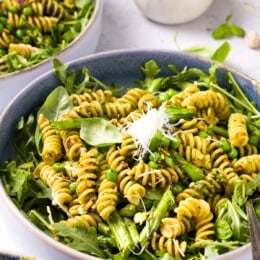 Pesto Pasta with Arugula in a large bowl.