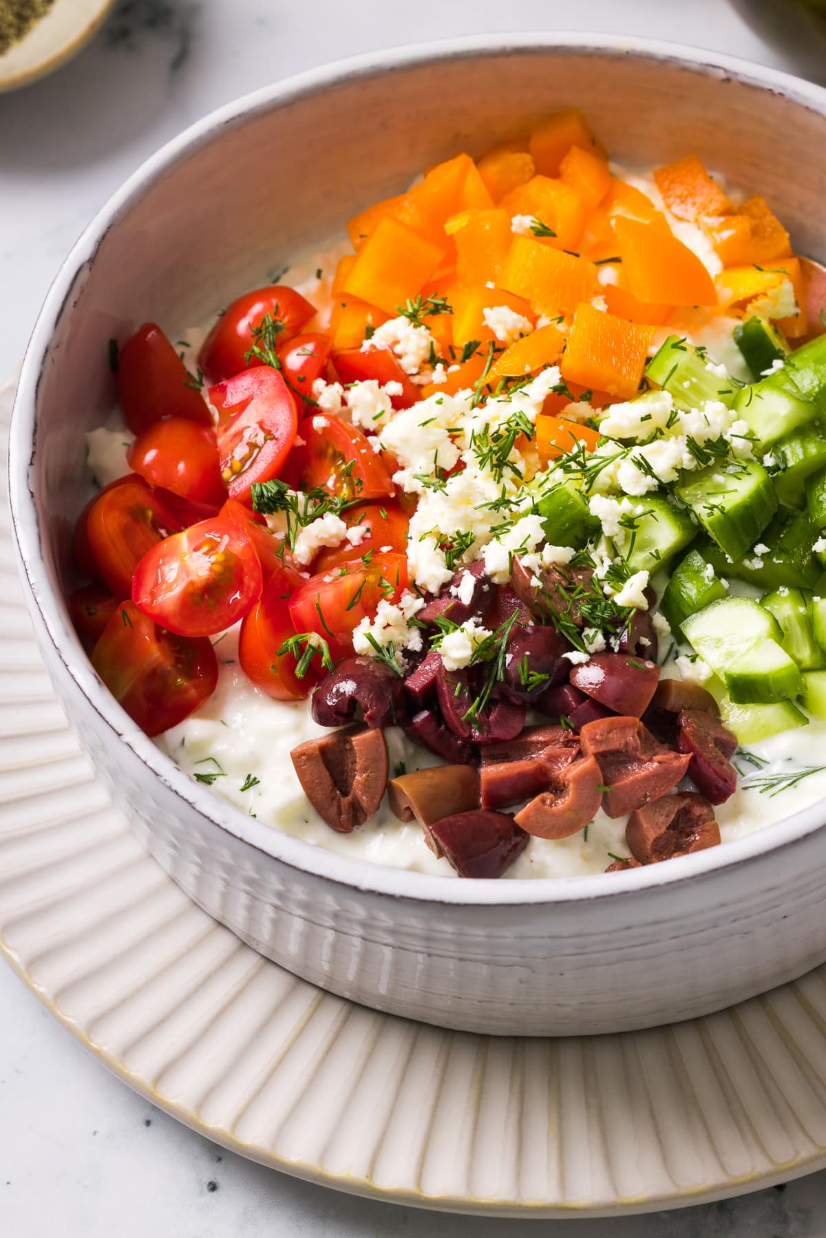 Cottage cheese with cucumber, tomato, pepper and olives