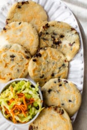 Pupusas with Curtido on a platter