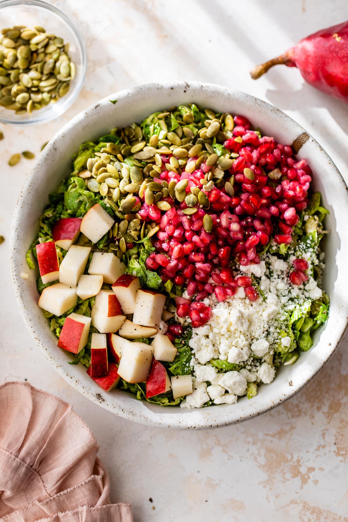 Shaved Brussels Sprouts Salad with Pears, Pomegranate and Pepitas