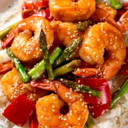 Stir fry shrimp and vegetables with rice on a plate
