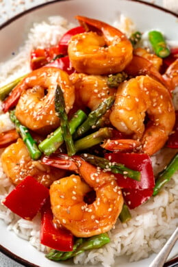 Stir fry shrimp and vegetables with rice on a plate