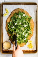Giant Chicken Cutlet Milanese with arugula and lemon