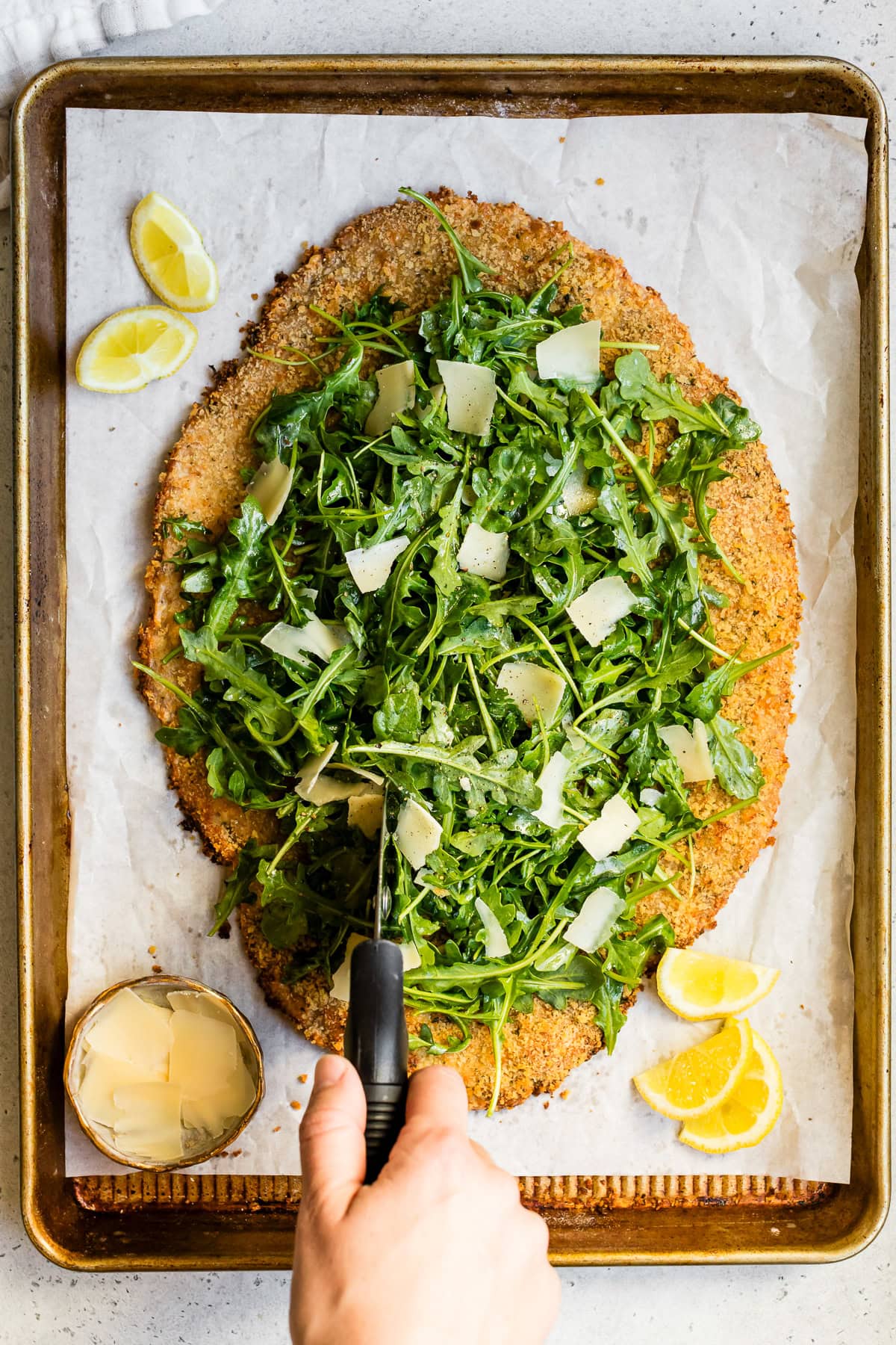 Giant Chicken Cutlet Milanese with arugula and lemon