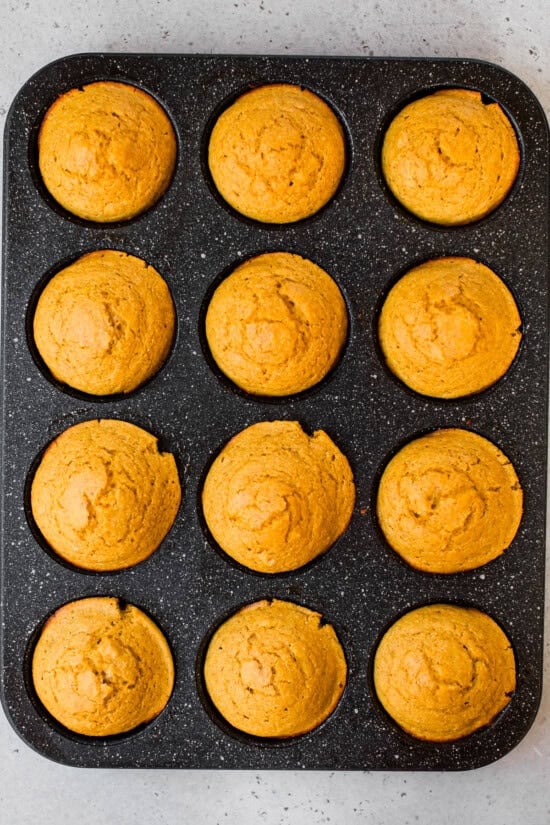 Pumpkin Cornbread Muffins in muffin tin