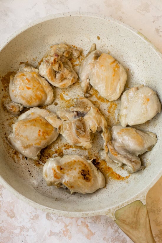 brown chicken thighs in skillet