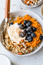 Healthy breakfast bowl with sweet potatoes, blueberries, and quinoa.